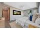 Well-lit main bedroom with a large bed and decorative art at 24437 N 94Th Ave, Peoria, AZ 85383