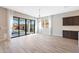 Open dining room area with sliding doors leading to a backyard pool and patio area at 24437 N 94Th Ave, Peoria, AZ 85383