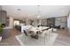 Open-concept dining area featuring a modern chandelier, adjacent to the full kitchen and cozy living space at , Peoria, AZ 85383