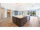 Spacious kitchen with a large island, stainless steel appliances, and views to the backyard at 24437 N 94Th Ave, Peoria, AZ 85383