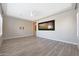 Spacious living room boasts recessed lighting, wood-style flooring, and contemporary design at 24437 N 94Th Ave, Peoria, AZ 85383