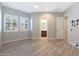 Spacious main bedroom features wood flooring, ample sunlight, and an ensuite bathroom at 24437 N 94Th Ave, Peoria, AZ 85383