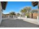 Large patio area featuring custom stone pavers and a decorative iron railing at 24437 N 94Th Ave, Peoria, AZ 85383