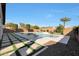 Backyard features a large pool and spa, grass turf and mature landscaping at 24437 N 94Th Ave, Peoria, AZ 85383