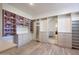 Custom walk-in closet features built-in shelving, drawers, and stylish design at 24437 N 94Th Ave, Peoria, AZ 85383