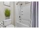 This bathroom features a shower and tub combination, with white tile and silver hardware at 10134 W Cashman Dr, Peoria, AZ 85383