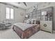 This bedroom features a large, decorative headboard, window with shutters, and carpet floors at 10134 W Cashman Dr, Peoria, AZ 85383