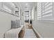 Inviting hallway with natural light, hardwood floors, shuttered windows, and stylish decor for a welcoming atmosphere at 10134 W Cashman Dr, Peoria, AZ 85383