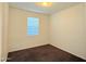 Cozy bedroom with neutral walls, carpet flooring, and a bright window at 1075 W Avalon Canyon Dr, Casa Grande, AZ 85122