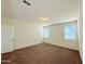 Bedroom featuring carpet flooring and natural light from two windows at 1075 W Avalon Canyon Dr, Casa Grande, AZ 85122