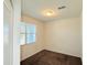 Neutral bedroom with a window, cream walls, and carpet at 1075 W Avalon Canyon Dr, Casa Grande, AZ 85122