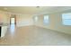 Bright and spacious living room with tile flooring and recessed lighting throughout at 1075 W Avalon Canyon Dr, Casa Grande, AZ 85122