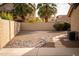 A spacious backyard with gravel, a rock border, and a block fence at 1119 S Presidio Dr, Gilbert, AZ 85233