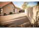 View of side yard featuring gravel, an AC unit, and a block fence at 1119 S Presidio Dr, Gilbert, AZ 85233