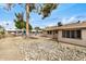 View of the property's backyard, featuring minimal desert landscaping at 11616 S Jokake St, Phoenix, AZ 85044