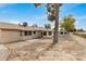 Wide view of the backyard and rear exterior of the home, desert landscaping at 11616 S Jokake St, Phoenix, AZ 85044