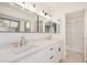 Bright bathroom with dual sinks, white countertops, and updated fixtures, plus natural light at 11616 S Jokake St, Phoenix, AZ 85044