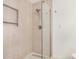 Modern bathroom with a glass enclosed shower and tiled walls and floor at 11616 S Jokake St, Phoenix, AZ 85044