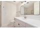 Bathroom featuring a white vanity with updated fixtures, a toilet and walk-in shower visible at 11616 S Jokake St, Phoenix, AZ 85044