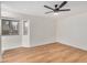 Bright bedroom with wood-look floors and a modern ceiling fan with natural light from the window at 11616 S Jokake St, Phoenix, AZ 85044