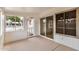 Bright sunroom with sliding glass doors and vinyl clad walls at 11616 S Jokake St, Phoenix, AZ 85044