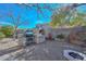 Charming backyard with barbecue, and mature trees creating a private space at 12721 W Valentine Ave, El Mirage, AZ 85335