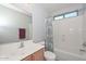 Well-lit bathroom featuring a shower-tub combination, new toilet, and vanity with sink at 12721 W Valentine Ave, El Mirage, AZ 85335