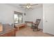 Inviting bedroom featuring a ceiling fan, wood-look flooring, and lots of natural light at 12721 W Valentine Ave, El Mirage, AZ 85335