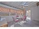 Covered patio dining area with ceiling fan, and exterior door to backyard at 12721 W Valentine Ave, El Mirage, AZ 85335