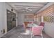 Covered patio dining area with ceiling fan, and sliding glass door to interior at 12721 W Valentine Ave, El Mirage, AZ 85335