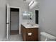 Bathroom featuring a double vanity with mirrors, white toilet, and stylish hexagon tile flooring at 1298 S 222Nd Ln, Buckeye, AZ 85326