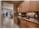 Butler pantry includes counter space and a wine refrigerator at 13117 W Micheltorena Dr, Sun City West, AZ 85375