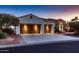 Beautiful single-story home featuring a three-car garage, stone accents, and lovely desert landscaping at 13117 W Micheltorena Dr, Sun City West, AZ 85375