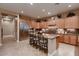 Gourmet kitchen with stainless steel appliances, ample cabinet space, granite counters, and a center island at 13117 W Micheltorena Dr, Sun City West, AZ 85375