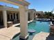 Luxury pool with spa and barstool seatings at 13117 W Micheltorena Dr, Sun City West, AZ 85375