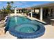 Custom pool and spa with a clear blue sky, lounge area and waterfall feature at 13117 W Micheltorena Dr, Sun City West, AZ 85375