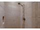 Tiled walk-in shower with shower head and tiled niche at 13117 W Micheltorena Dr, Sun City West, AZ 85375