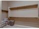 Spacious walk-in closet with ample storage space including multiple rods and shelves for organization at 13117 W Micheltorena Dr, Sun City West, AZ 85375