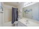 Clean bathroom featuring a tub with shower, a vanity with a mirror, and neutral decor at 1371 E Cactus Bloom Way, Casa Grande, AZ 85122