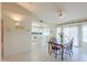 Bright dining area with tile floors, a ceiling fan, and sliding glass doors at 1371 E Cactus Bloom Way, Casa Grande, AZ 85122