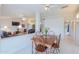 Open concept dining area with tile floors, a ceiling fan, and easy access to the living room at 1371 E Cactus Bloom Way, Casa Grande, AZ 85122