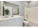 Well-lit bathroom featuring a sleek vanity, modern fixtures, and a shower-tub combination at 15579 W Williams St, Goodyear, AZ 85338