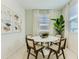 Airy dining room with modern furnishings, neutral walls, natural lighting and views of outside at 15579 W Williams St, Goodyear, AZ 85338