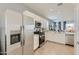 This open concept kitchen has stainless steel appliances and flows seamlessly into the living area at 15579 W Williams St, Goodyear, AZ 85338