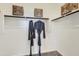 Spacious walk-in closet with shelving and hanging rods for optimal storage at 15579 W Williams St, Goodyear, AZ 85338