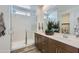 Modern bathroom featuring a glass shower door, double sinks, and sleek design at 15751 W Pioneer St, Goodyear, AZ 85338