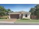 New construction home with a brick driveway and a two-car garage at 15751 W Pioneer St, Goodyear, AZ 85338