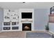 Cozy living room showcasing a fireplace with built-ins, recessed lighting, and neutral paint colors at 16029 N 171St Dr, Surprise, AZ 85388