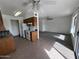 Well-lit kitchen with tiled floor, pantry, and bright white appliances at 16657 E Gunsight Dr # 296, Fountain Hills, AZ 85268