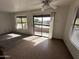 Spacious living room with carpeted floors, tile floors, and balcony access at 16657 E Gunsight Dr # 296, Fountain Hills, AZ 85268